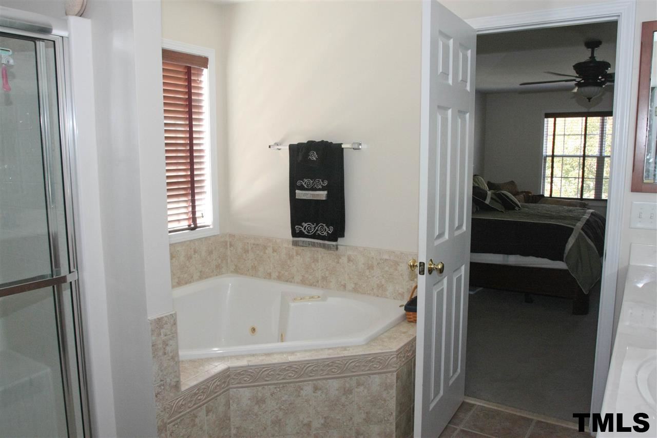 197 Mickleson Ridge Drive Raleigh, NC 27603 - Photo 16 of 25 a bathroom with a bathtub