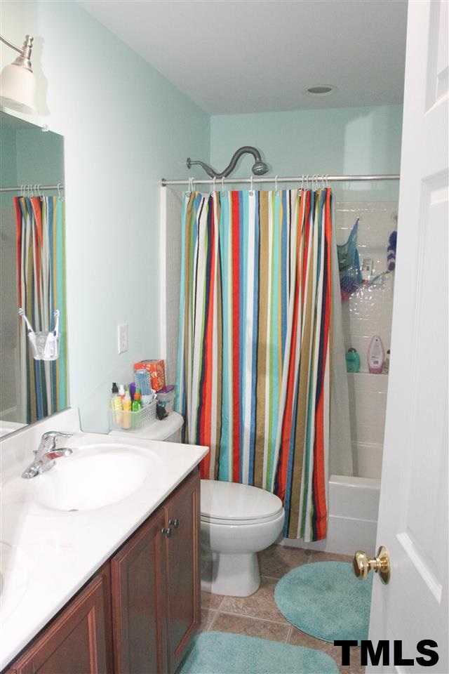 197 Mickleson Ridge Drive Raleigh, NC 27603 - Photo 19 of 25 a bathroom with a sink and a toilet