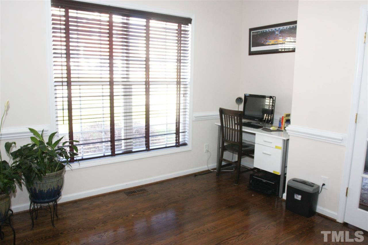197 Mickleson Ridge Drive Raleigh, NC 27603 - Photo 4 of 25 a view of a workspace with furniture and a window