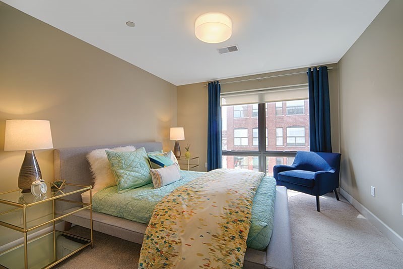 33 Rogers Street, Unit 201 Cambridge, MA 02142 - Photo 4 of 11 a bedroom with a bed and a window