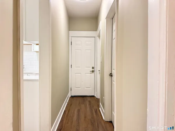a view of a livingroom from a hallway