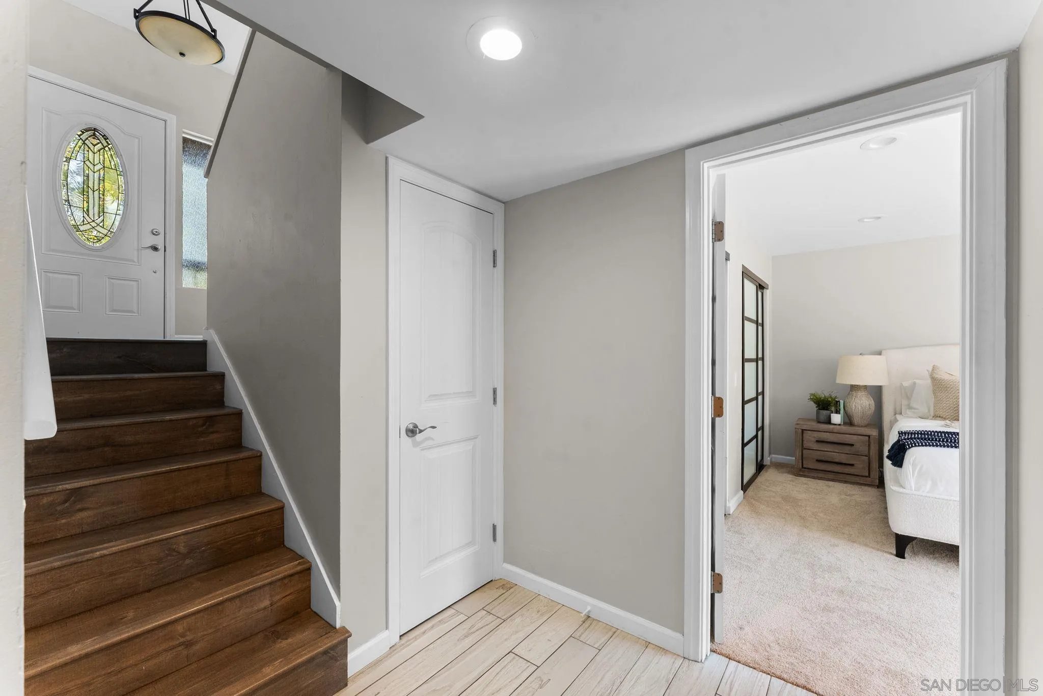 1509 Rimrock Drive Escondido, CA 92027 - Photo 29 of 48 a view of a hallway with wooden floor and staircase
