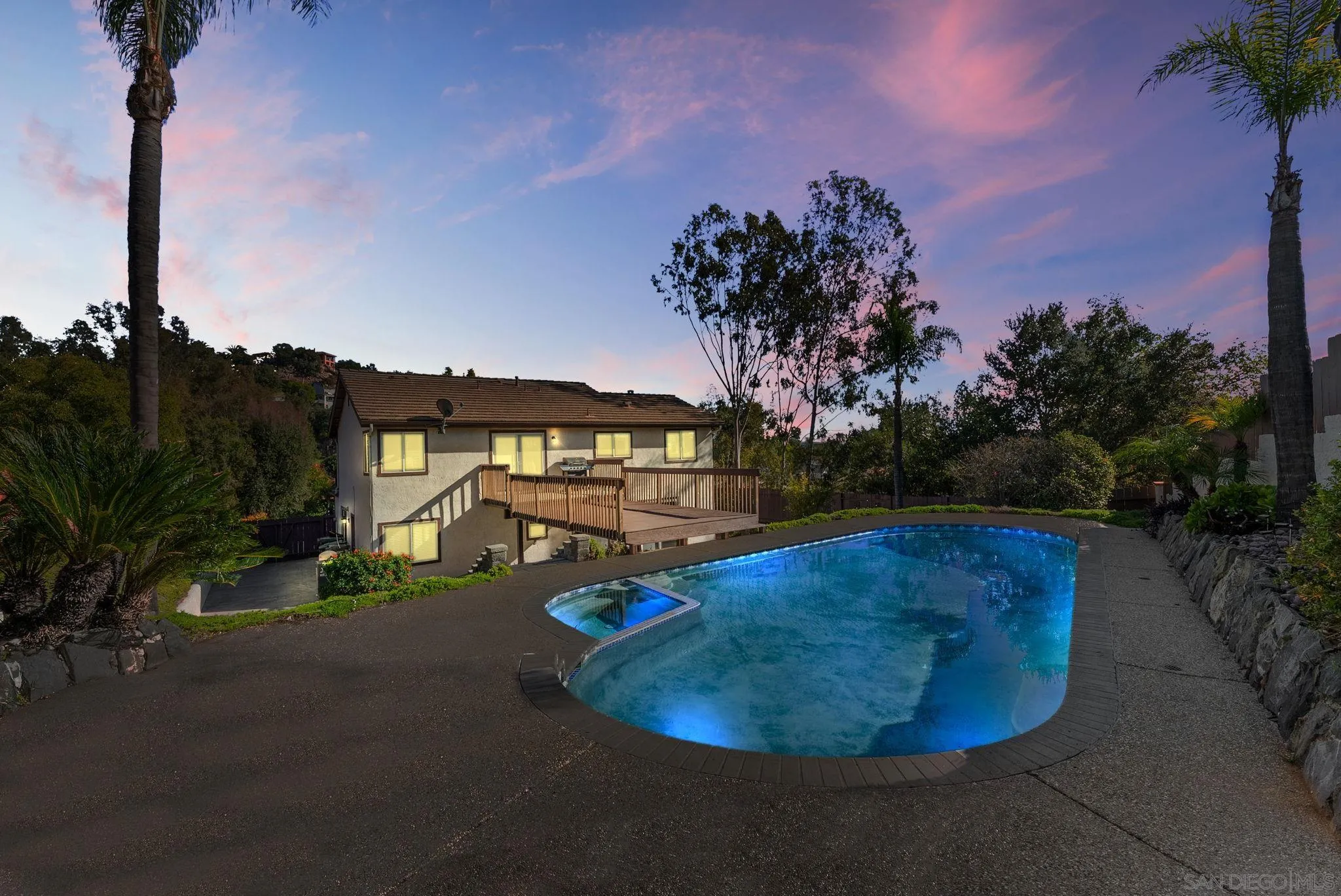 1509 Rimrock Drive Escondido, CA 92027 - Photo 37 of 48 a view of a swimming pool with a yard in front of it