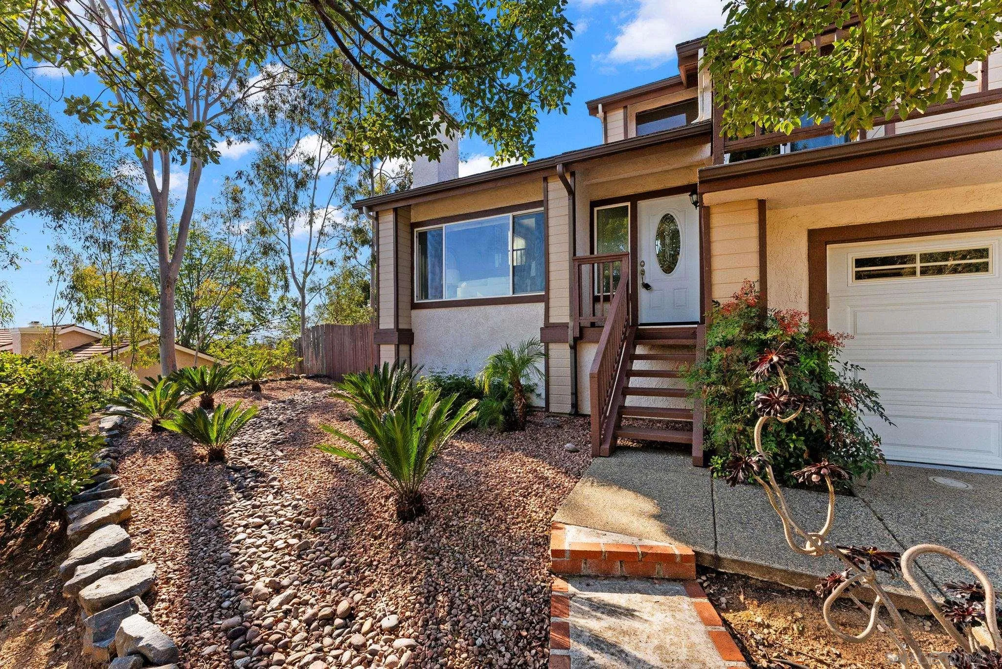 1509 Rimrock Drive Escondido, CA 92027 - Photo 46 of 48 a potted plant sitting in front of a house