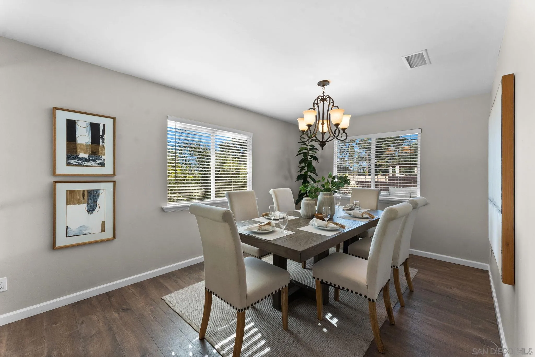 1509 Rimrock Drive Escondido, CA 92027 - Photo 6 of 48 a dining room with furniture a chandelier and wooden floor