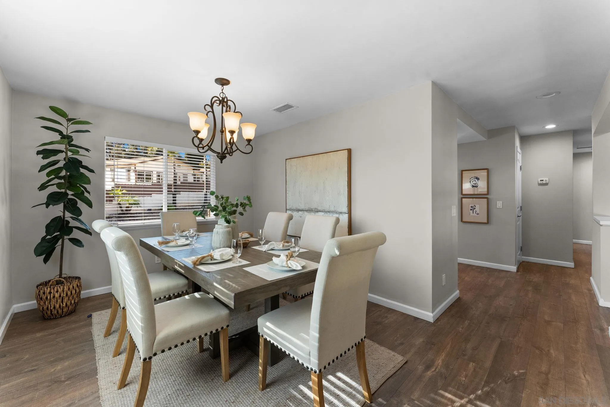 1509 Rimrock Drive Escondido, CA 92027 - Photo 8 of 48 a dining room with furniture potted plants and wooden floor