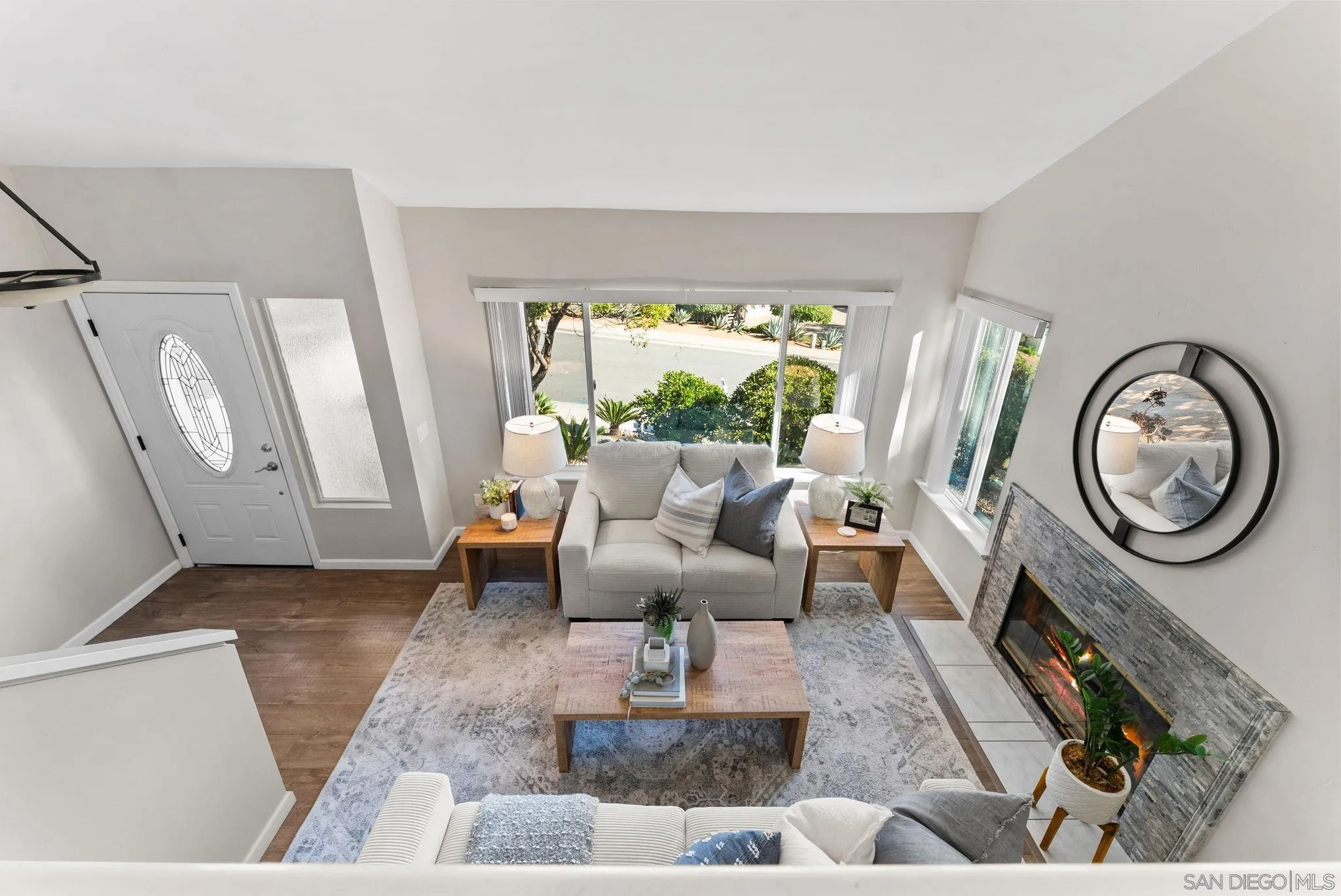 1509 Rimrock Drive Escondido, CA 92027 - Photo 9 of 48 a living room with furniture a large window and a fireplace