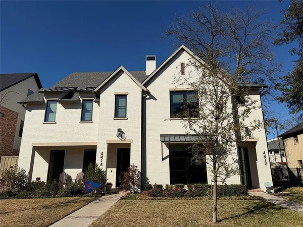 a front view of a house with yard