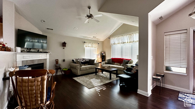 929 West 1920 South, Unit A Syracuse, UT 84075 - Photo 6 of 26 Living room with a tile fireplace, vaulted ceiling, dark hardwood / wood-style floors, and ceiling fan