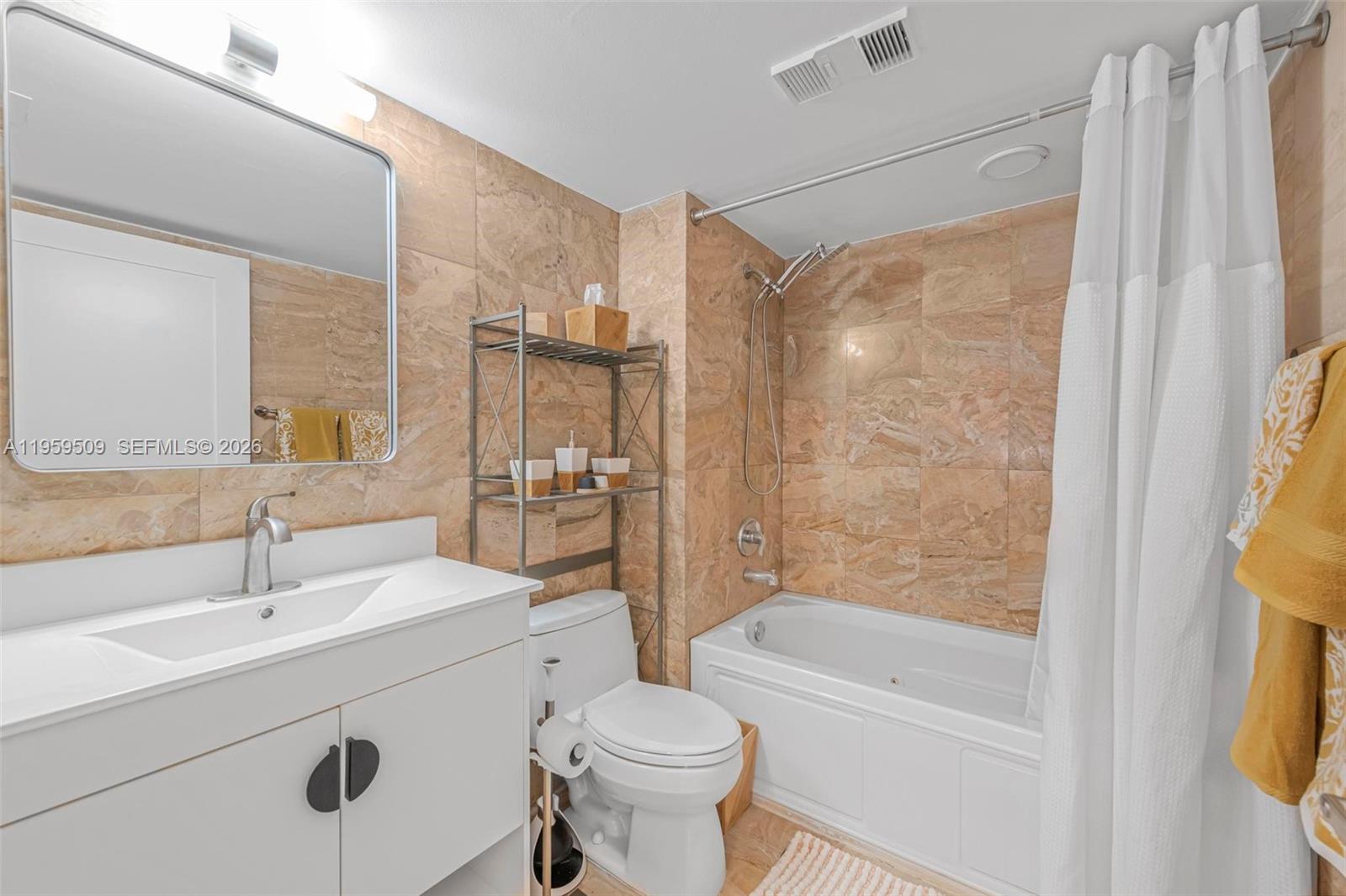 540 Brickell Key Drive, Unit 500 Miami, FL 33131 - Photo 16 of 26 a bathroom with a sink toilet and shower