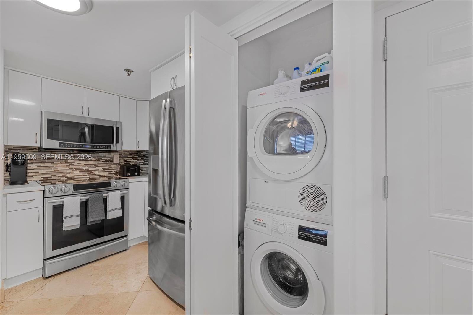 540 Brickell Key Drive, Unit 500 Miami, FL 33131 - Photo 18 of 26 a utility room with sink dryer and washer