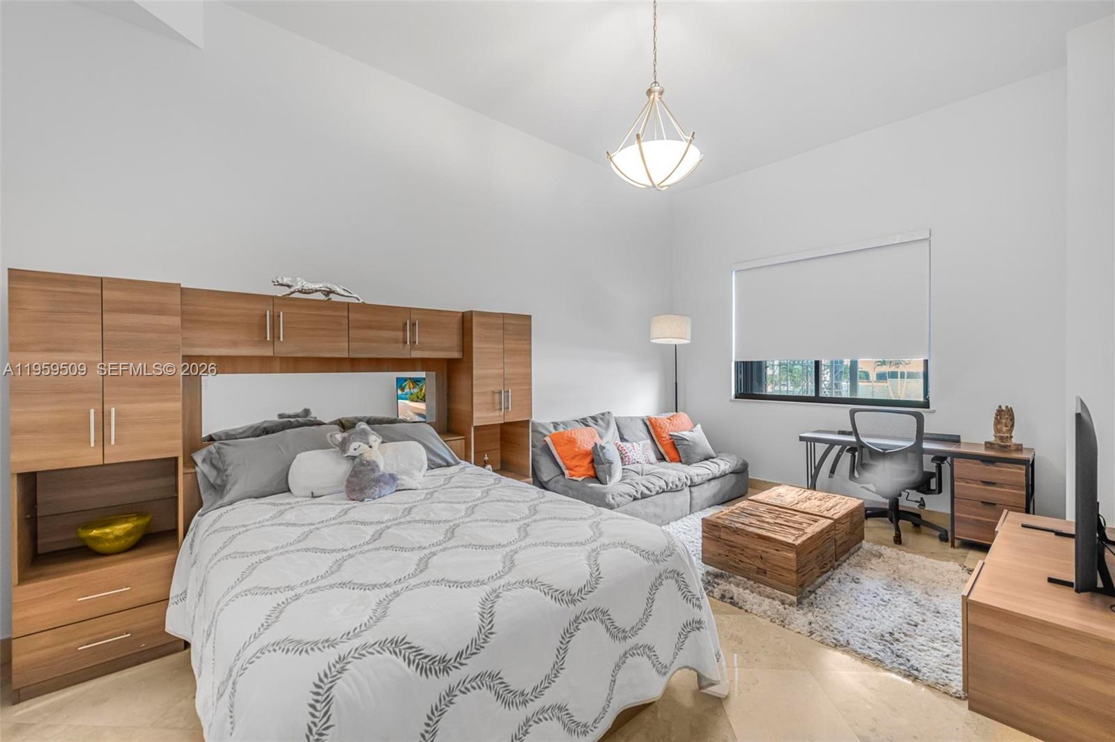 540 Brickell Key Drive, Unit 500 Miami, FL 33131 - Photo 9 of 26 a bedroom with bed and window