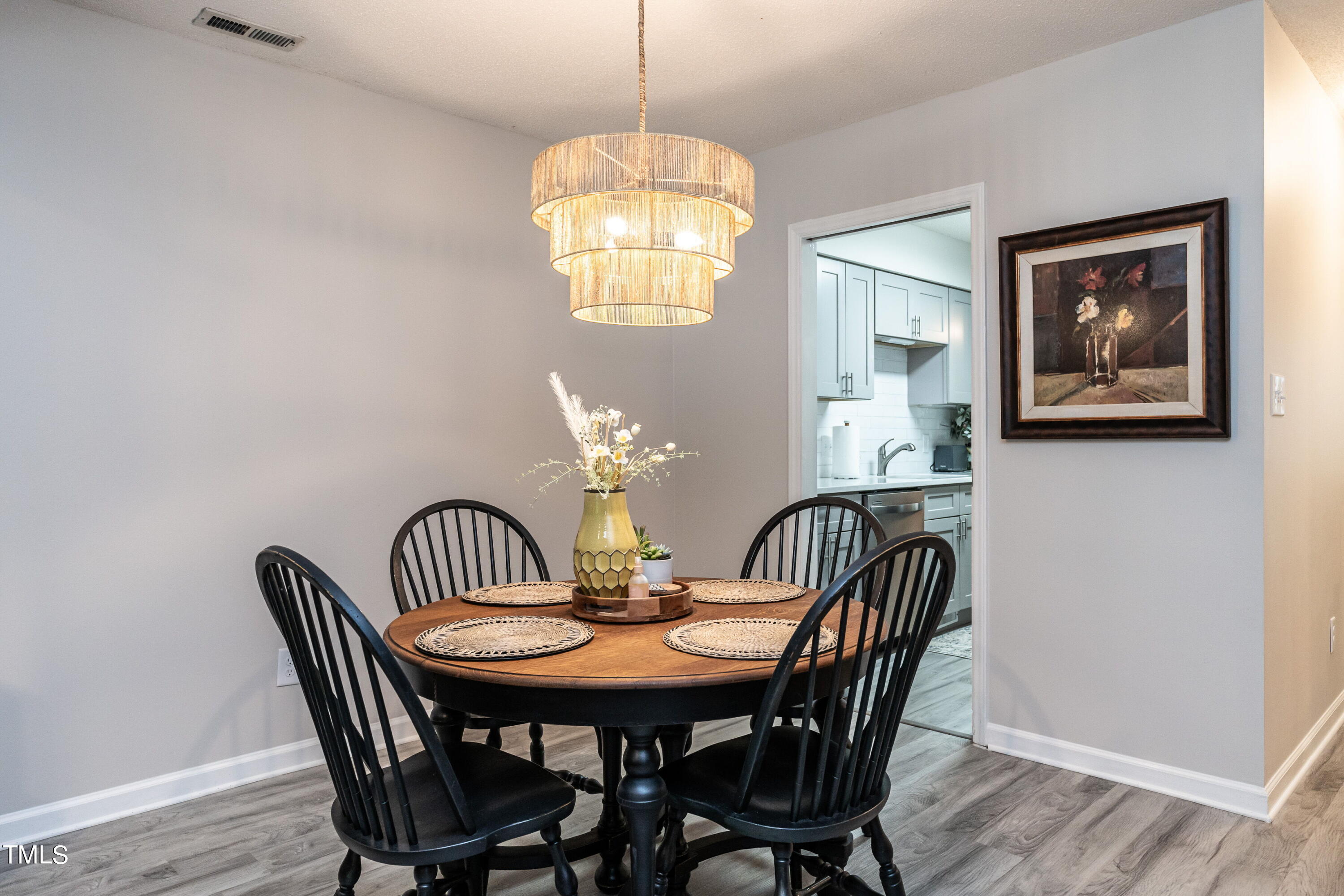 5819 Branchwood Road Raleigh, NC 27609 - Photo 20 of 40 a view of a dining room with furniture window and wooden floor