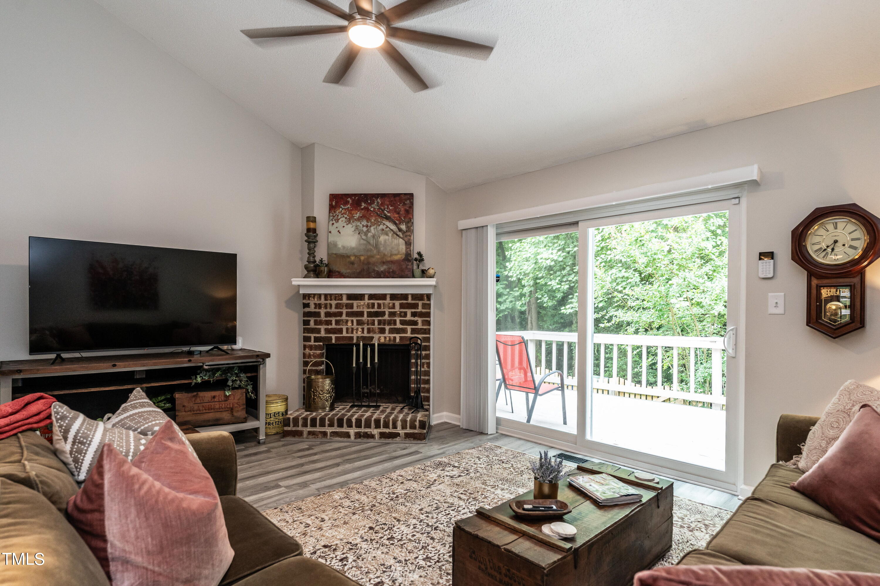 5819 Branchwood Road Raleigh, NC 27609 - Photo 23 of 40 a living room with furniture and a flat screen tv