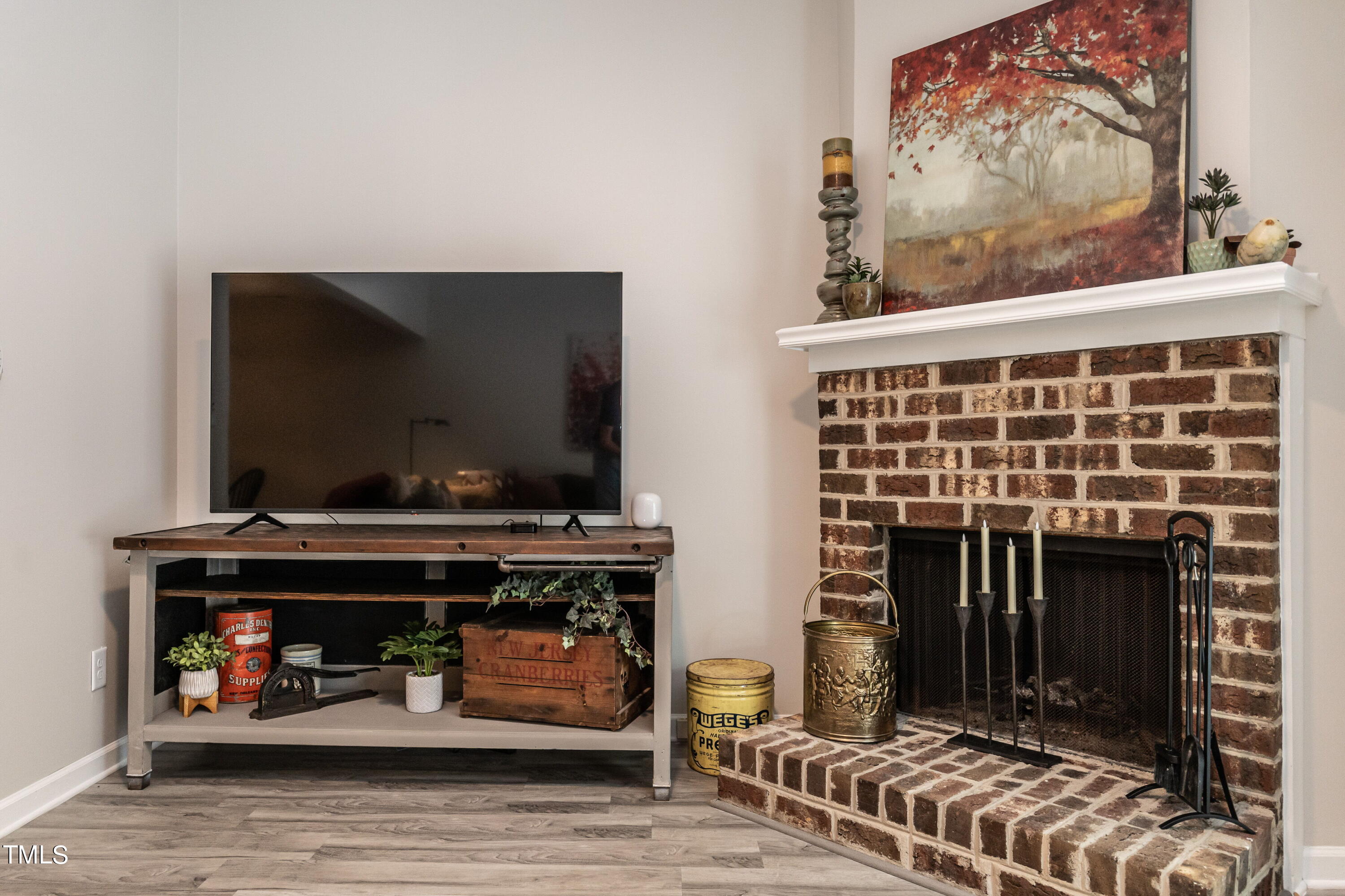 5819 Branchwood Road Raleigh, NC 27609 - Photo 25 of 40 a living room with furniture and a fireplace