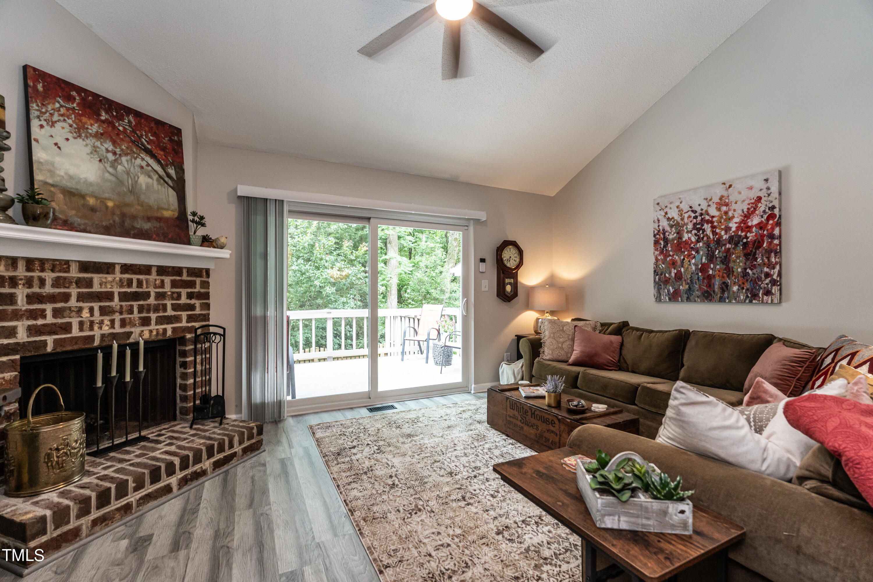 5819 Branchwood Road Raleigh, NC 27609 - Photo 3 of 40 a living room with furniture and a fireplace