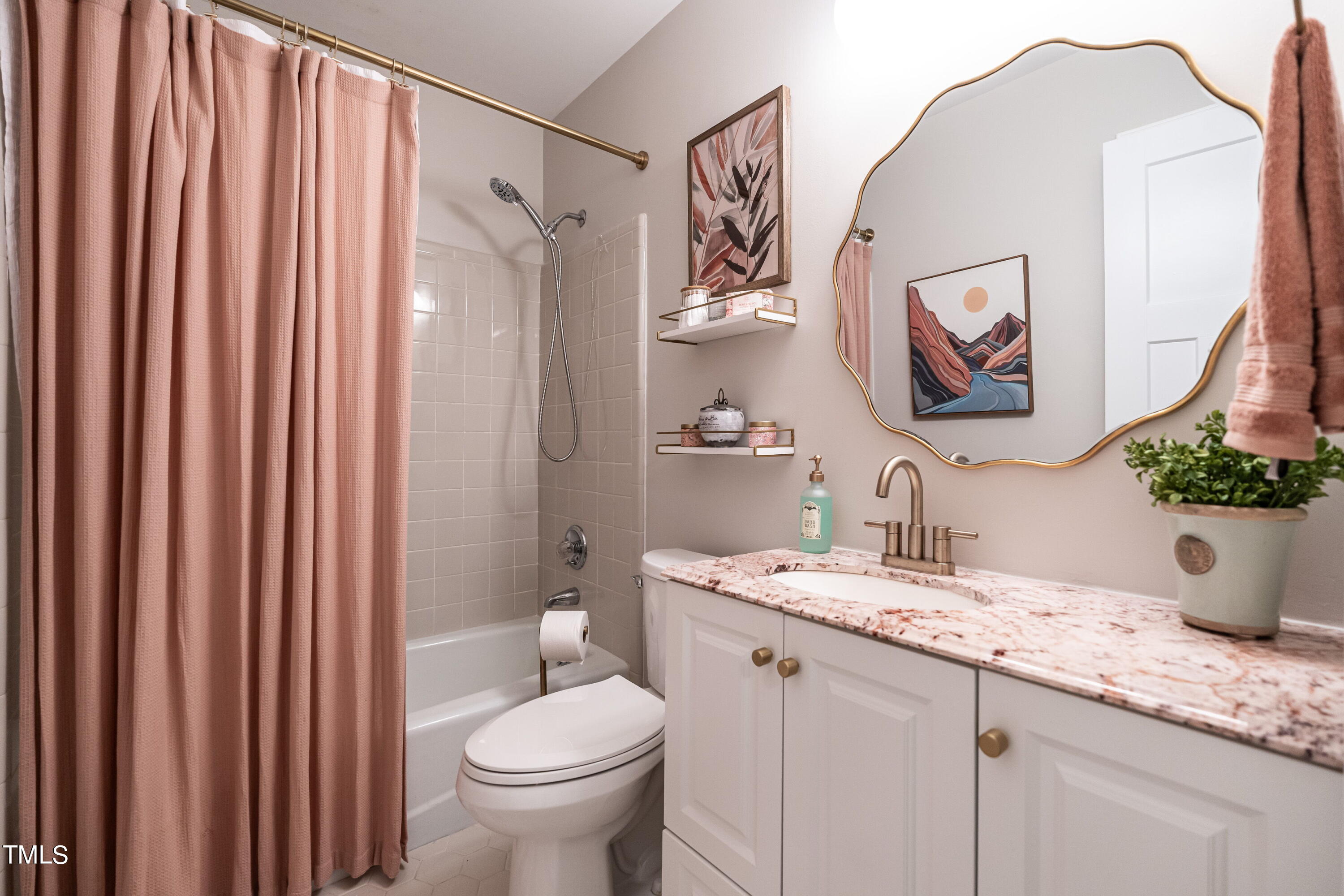 5819 Branchwood Road Raleigh, NC 27609 - Photo 33 of 40 a bathroom with a granite countertop sink mirror vanity and toilet