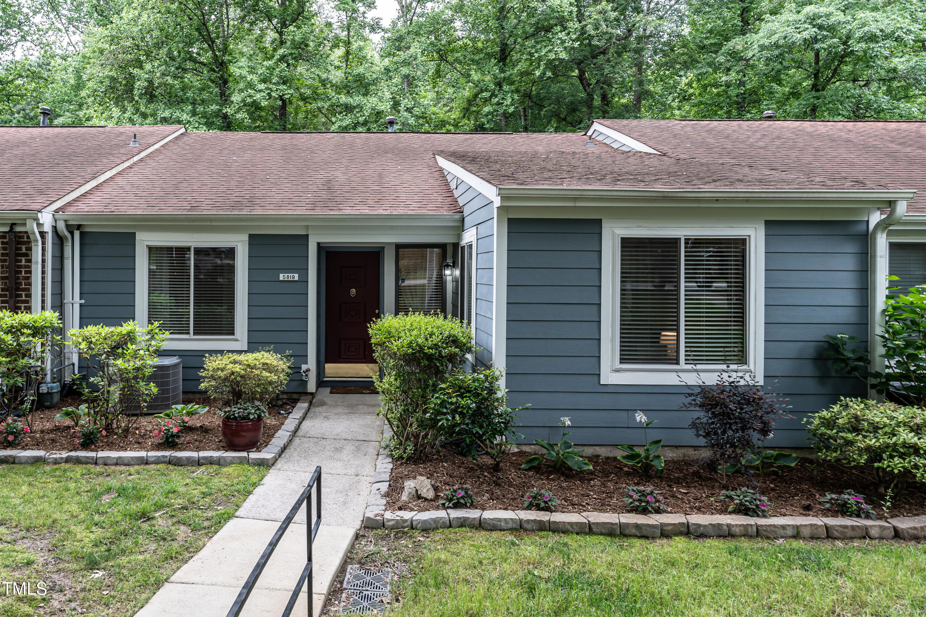 5819 Branchwood Road Raleigh, NC 27609 - Photo 9 of 40 a front view of a house with garden