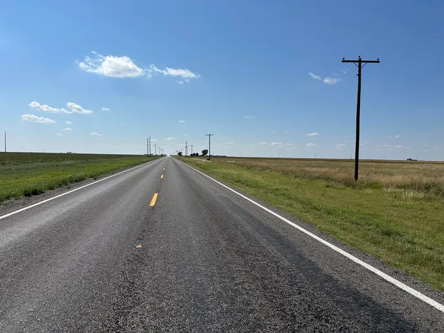 a view of an empty room and floor to ceiling window