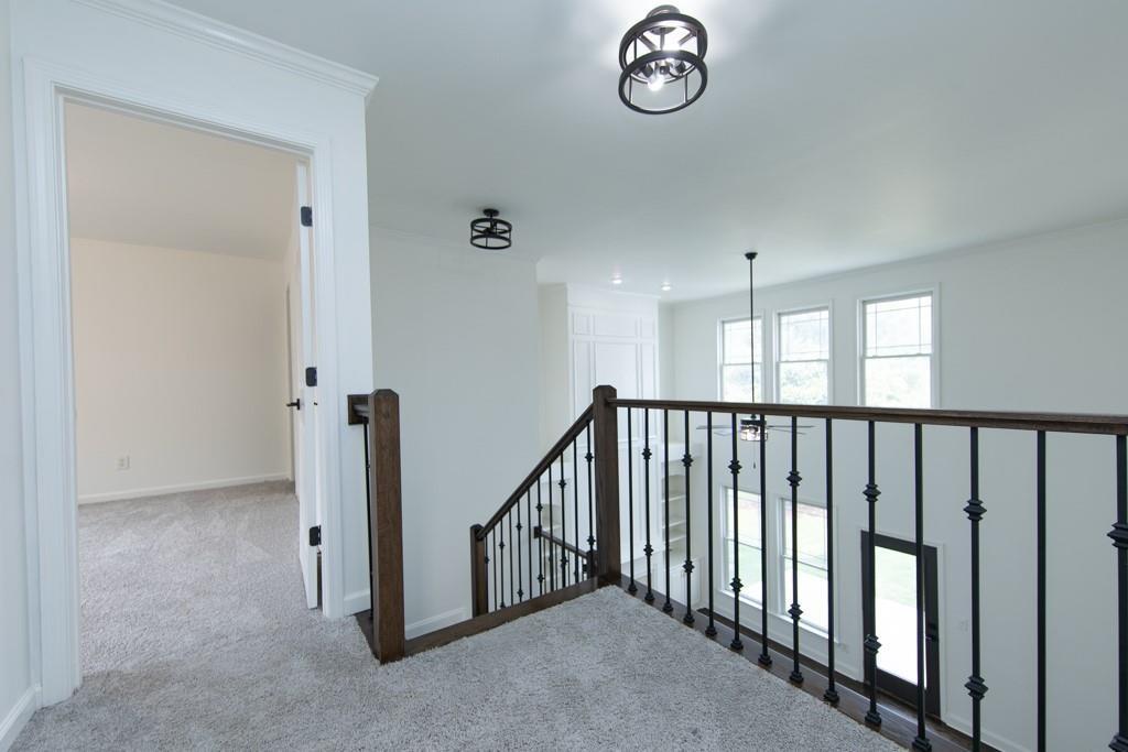 3501 Downing Drive Cumming, GA 30040 - Photo 22 of 26 a view of a hallway with windows