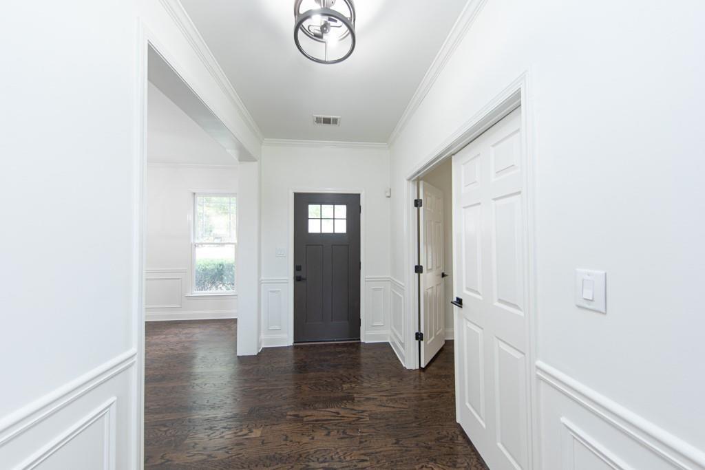 3501 Downing Drive Cumming, GA 30040 - Photo 4 of 26 a view of a hallway with wooden floor