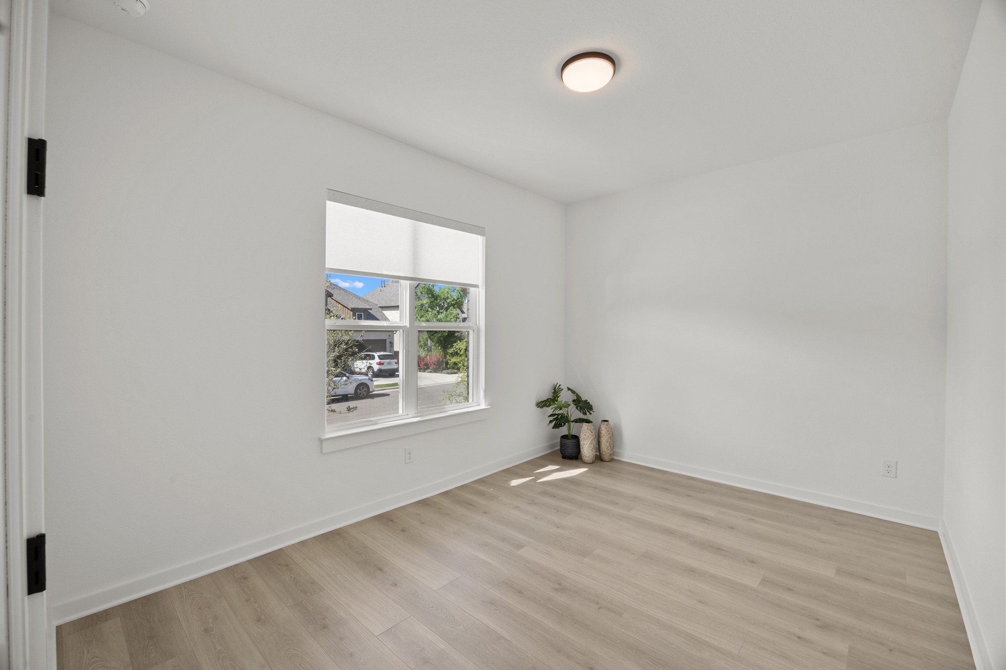 6000 Sean Paul Lane Georgetown, TX 78628 - Photo 22 of 35 Empty room featuring baseboards and light wood finished floors