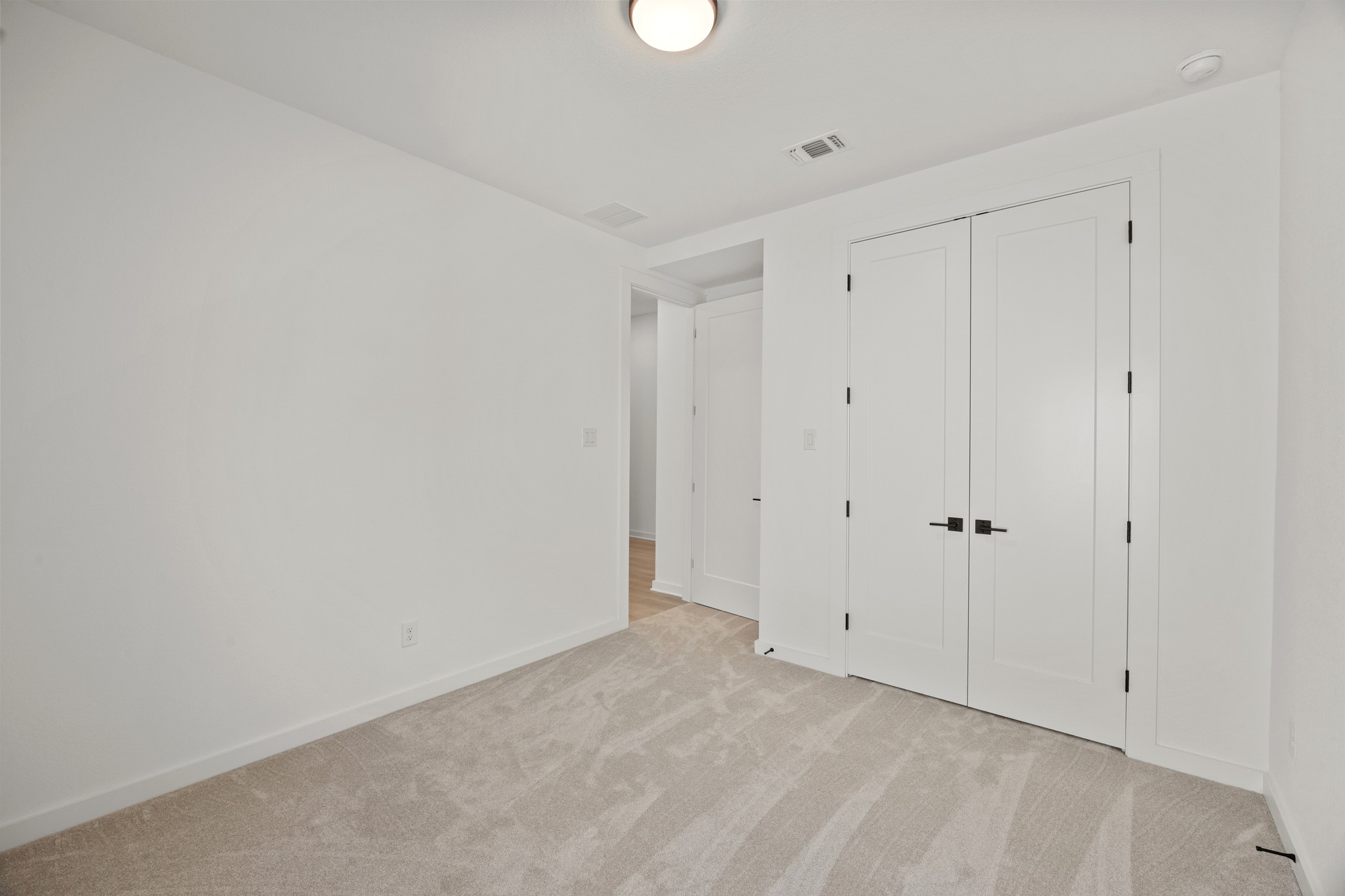 6000 Sean Paul Lane Georgetown, TX 78628 - Photo 25 of 35 Unfurnished bedroom with light carpet and a closet