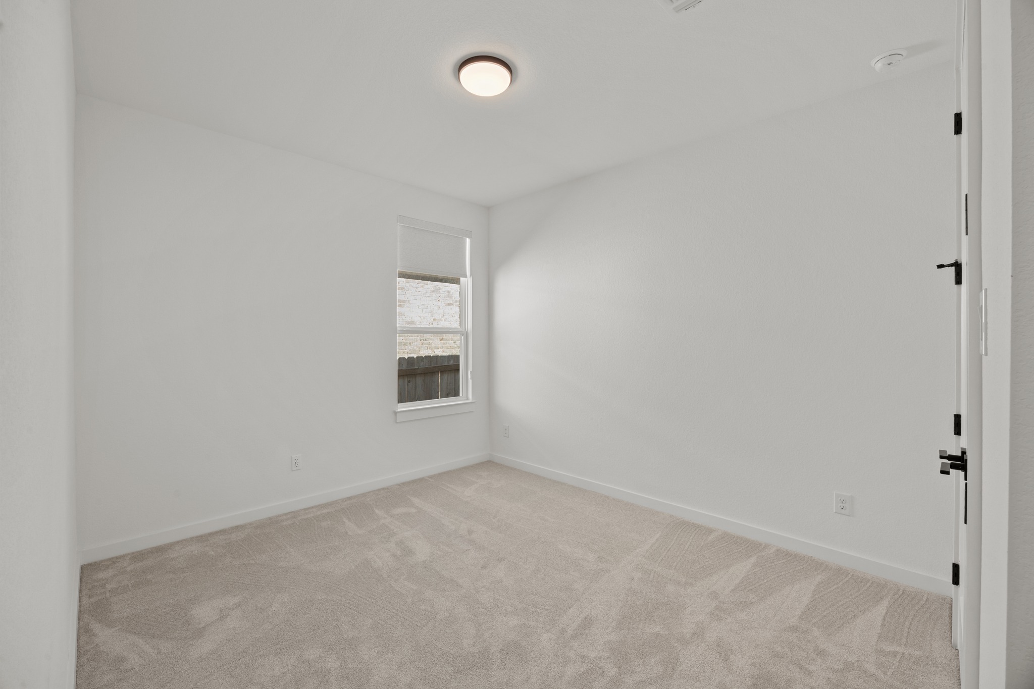 6000 Sean Paul Lane Georgetown, TX 78628 - Photo 26 of 35 Empty room featuring baseboards and light colored carpet