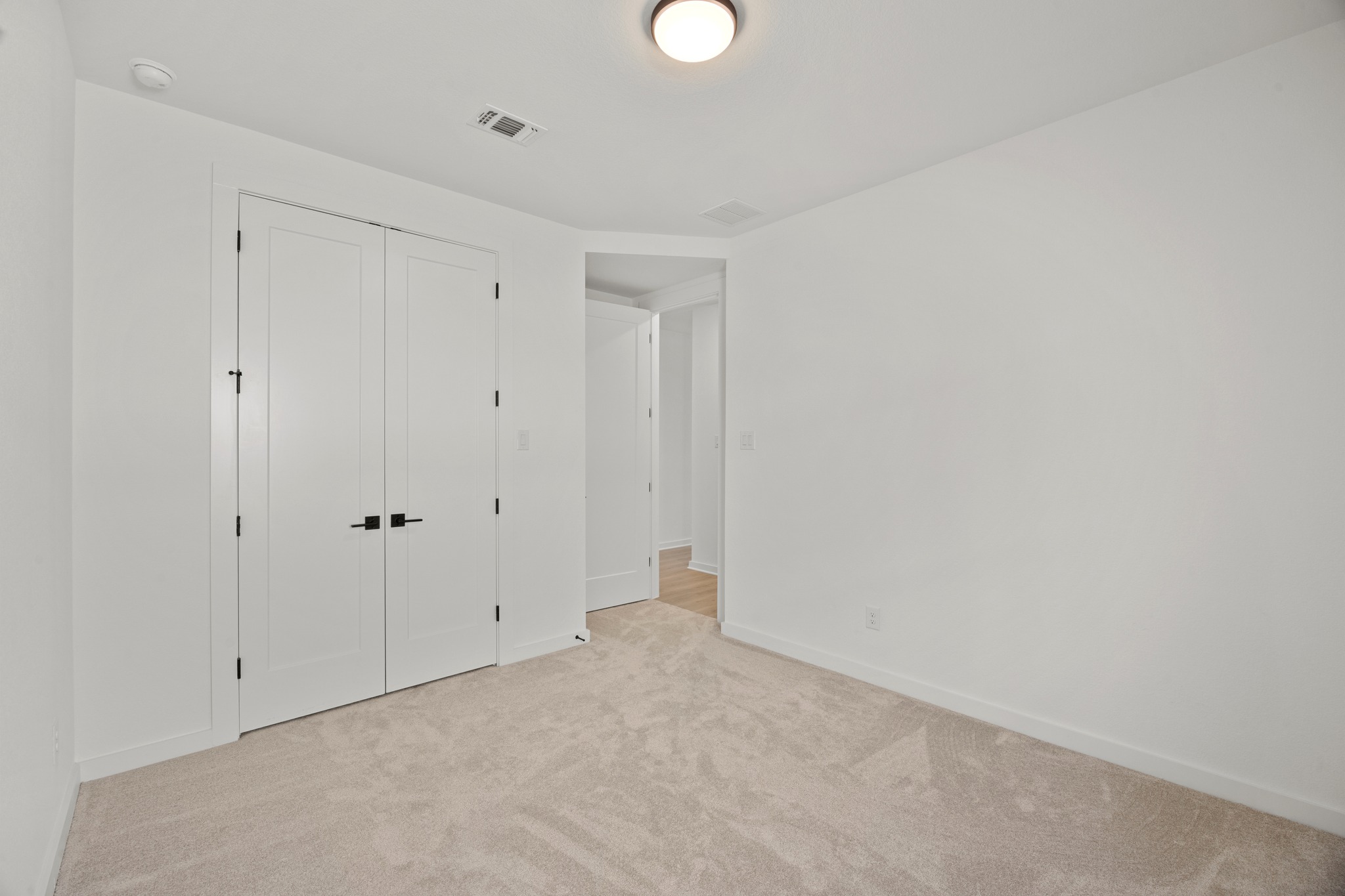 6000 Sean Paul Lane Georgetown, TX 78628 - Photo 27 of 35 Unfurnished bedroom with light carpet and a closet