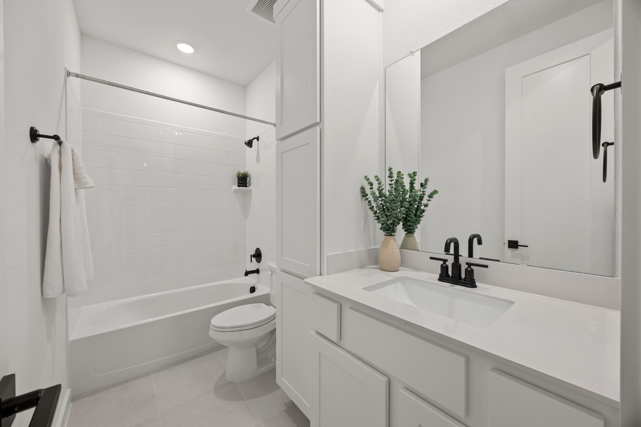 6000 Sean Paul Lane Georgetown, TX 78628 - Photo 28 of 35 Bathroom with vanity, shower / bath combination, light tile patterned flooring, and recessed lighting