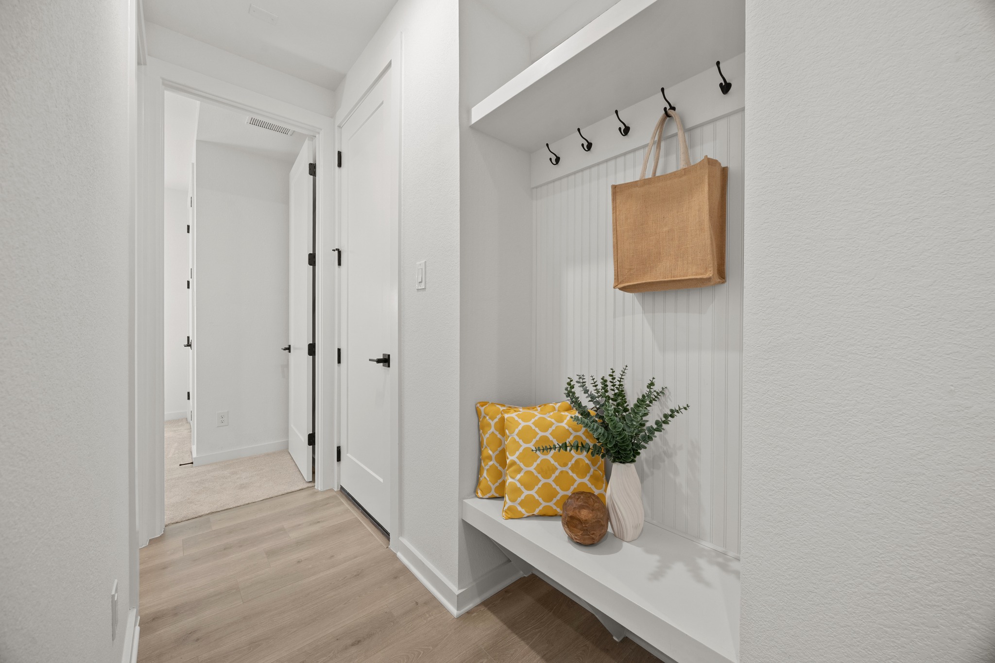 6000 Sean Paul Lane Georgetown, TX 78628 - Photo 29 of 35 Mudroom with light wood-style floors and a textured wall