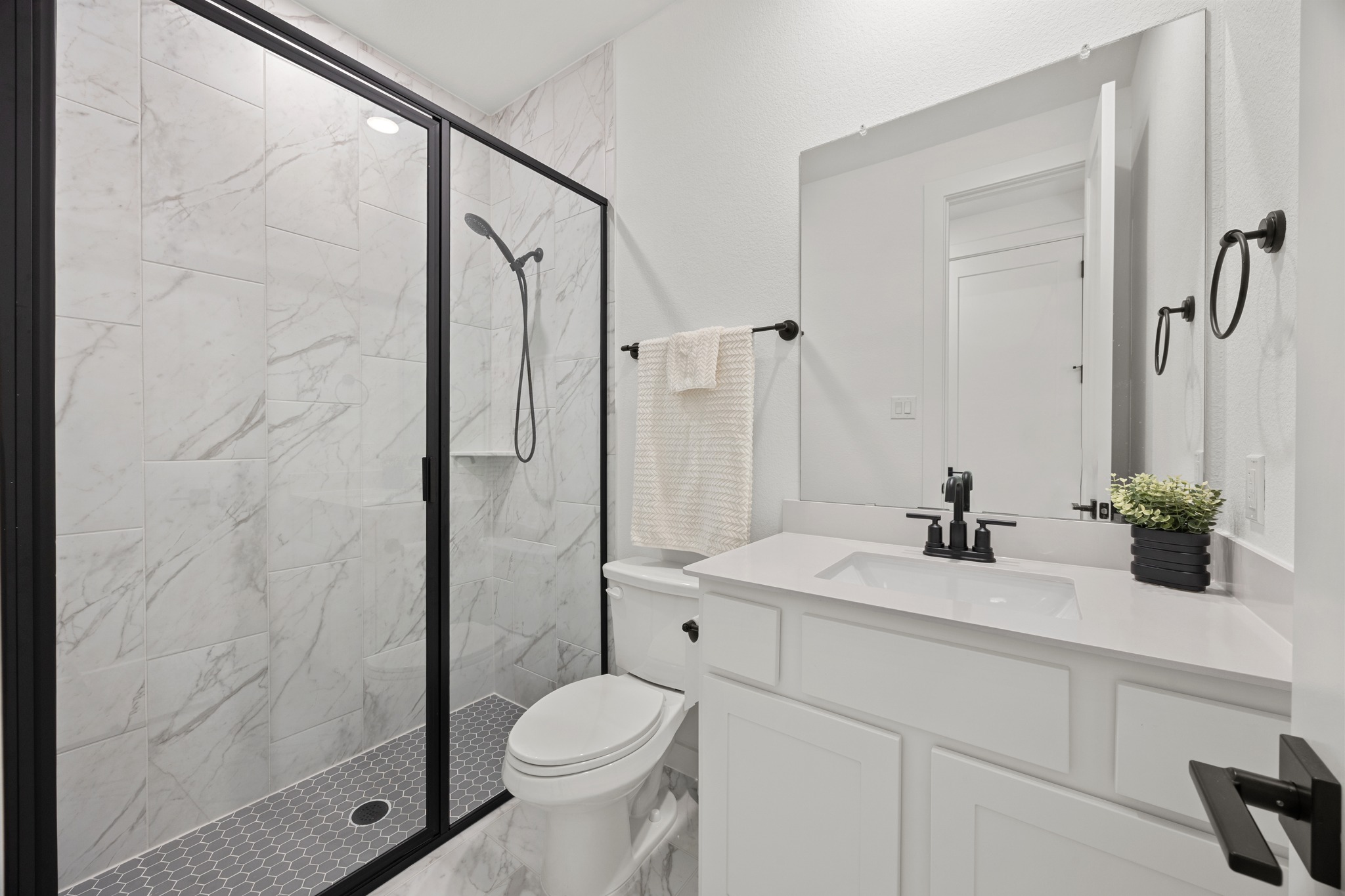 6000 Sean Paul Lane Georgetown, TX 78628 - Photo 31 of 35 Full bathroom with vanity, a marble finish shower, and marble finish floors