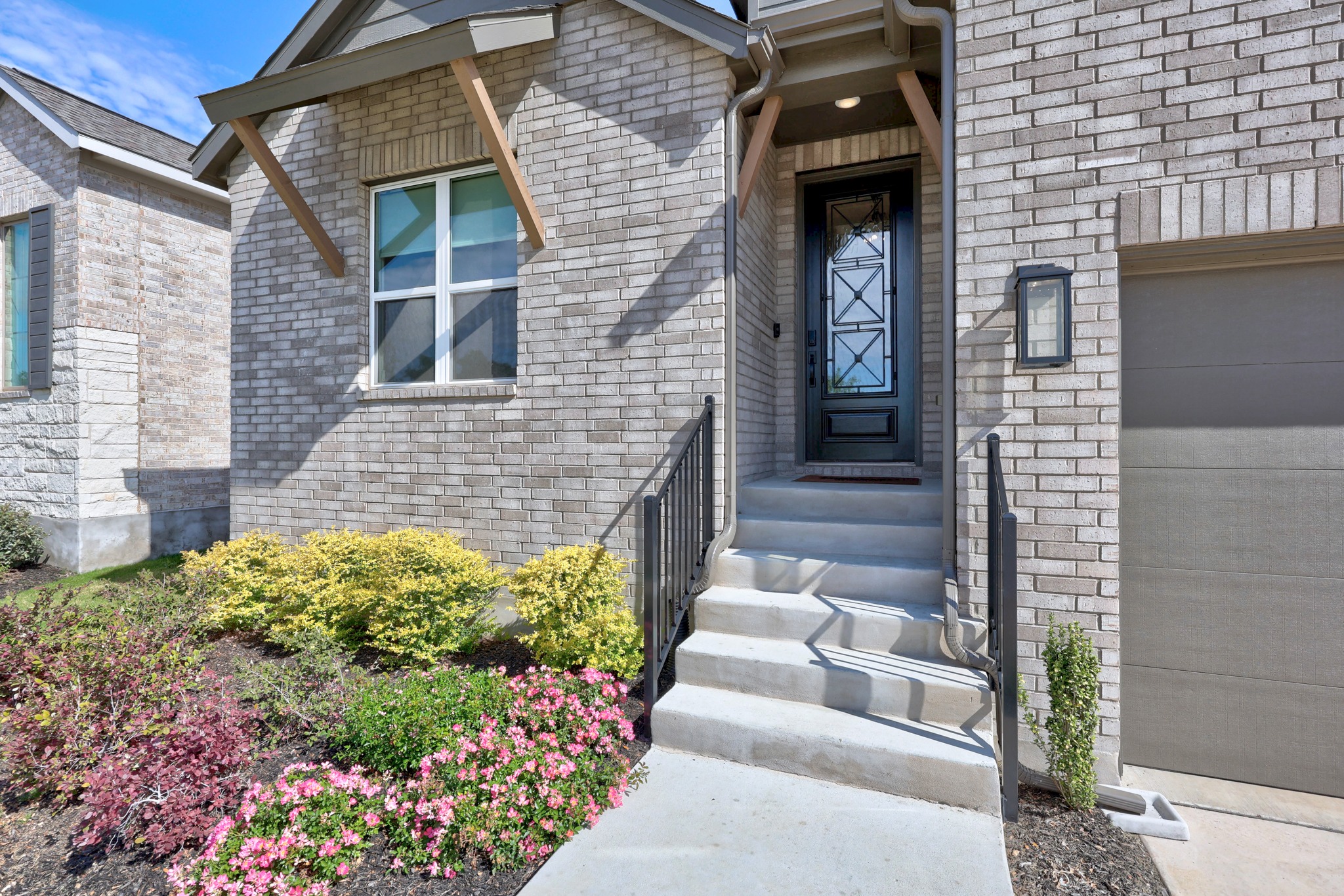 6000 Sean Paul Lane Georgetown, TX 78628 - Photo 4 of 35 Entrance to property featuring brick siding and a garage