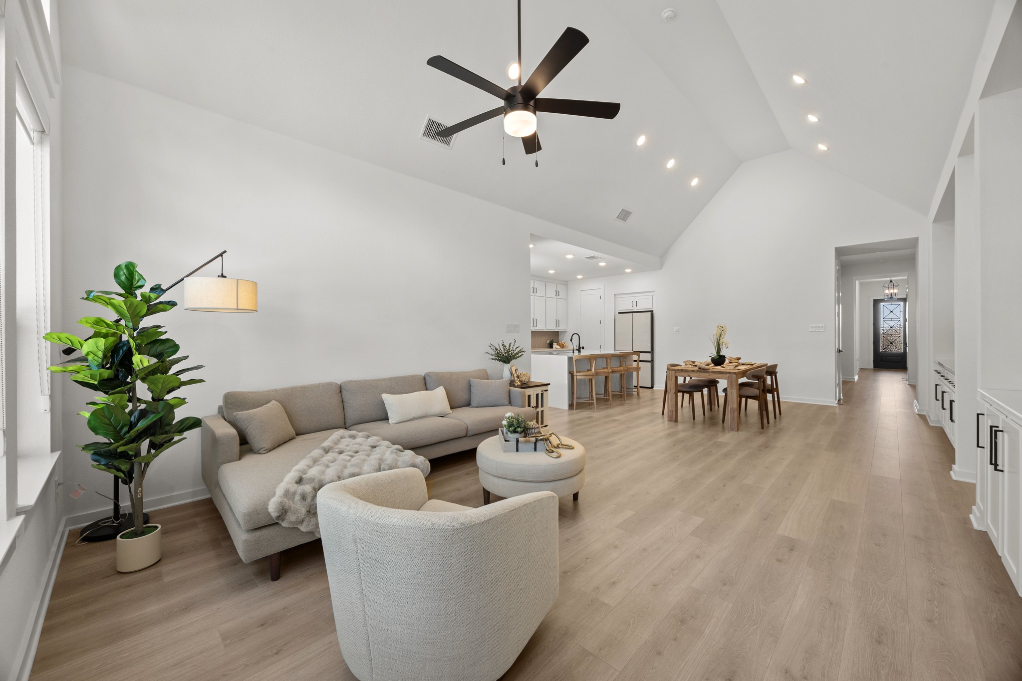 6000 Sean Paul Lane Georgetown, TX 78628 - Photo 7 of 35 Living room featuring a ceiling fan, light wood-style flooring, vaulted ceiling, and recessed lighting