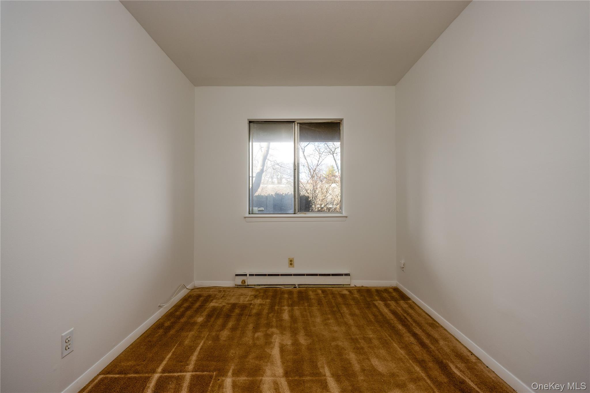 306 Old Country Road, Unit 306 Elmsford, NY 10523 - Photo 21 of 35 Same view of the second bedroom as it currently exists. The versatile second bedroom can be used for family/guest sleeping area, home office, gym, or den.