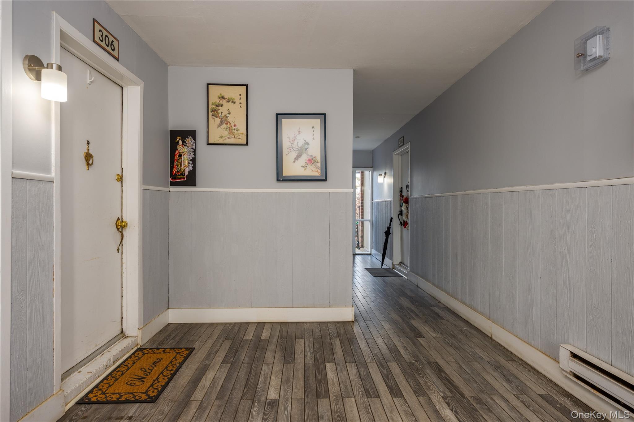 306 Old Country Road, Unit 306 Elmsford, NY 10523 - Photo 5 of 35 View of the well-maintained lobby and front door entry to unit #306.