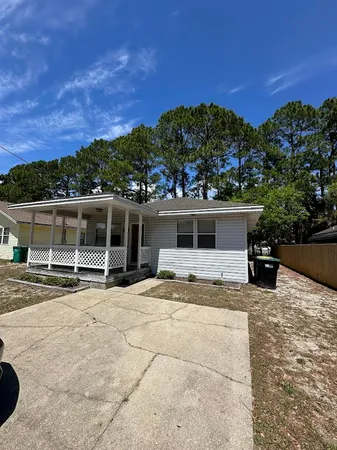 a view of a house with outdoor space and sitting area
