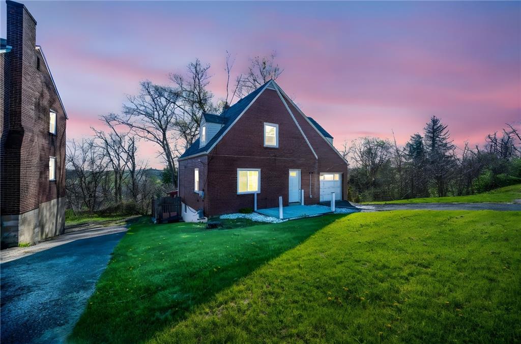 4030 Lebanon Church Road West Mifflin, PA 15122 - Photo 2 of 45 a front view of a house with a yard