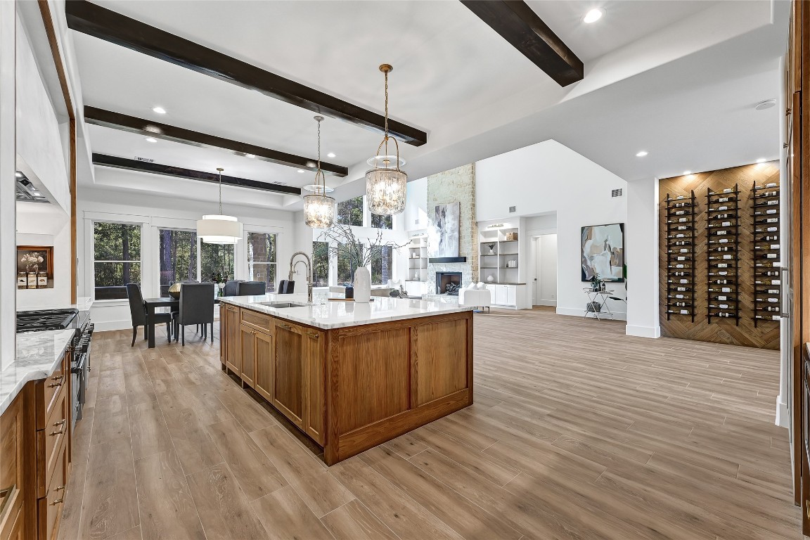 7244 Red Oak Grove Road Montgomery, TX 77316 - Photo 11 of 49 a large white kitchen with wooden floor and a large window