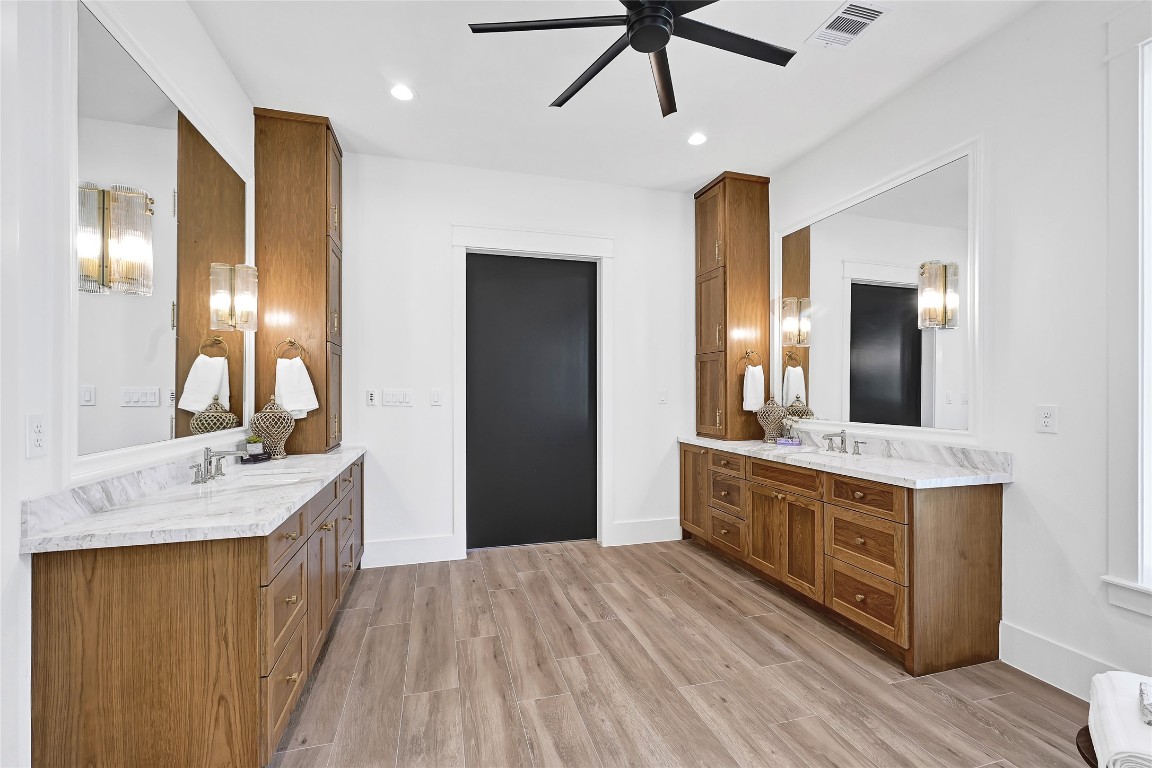 7244 Red Oak Grove Road Montgomery, TX 77316 - Photo 19 of 49 a spacious bathroom with a double vanity sink and a mirror