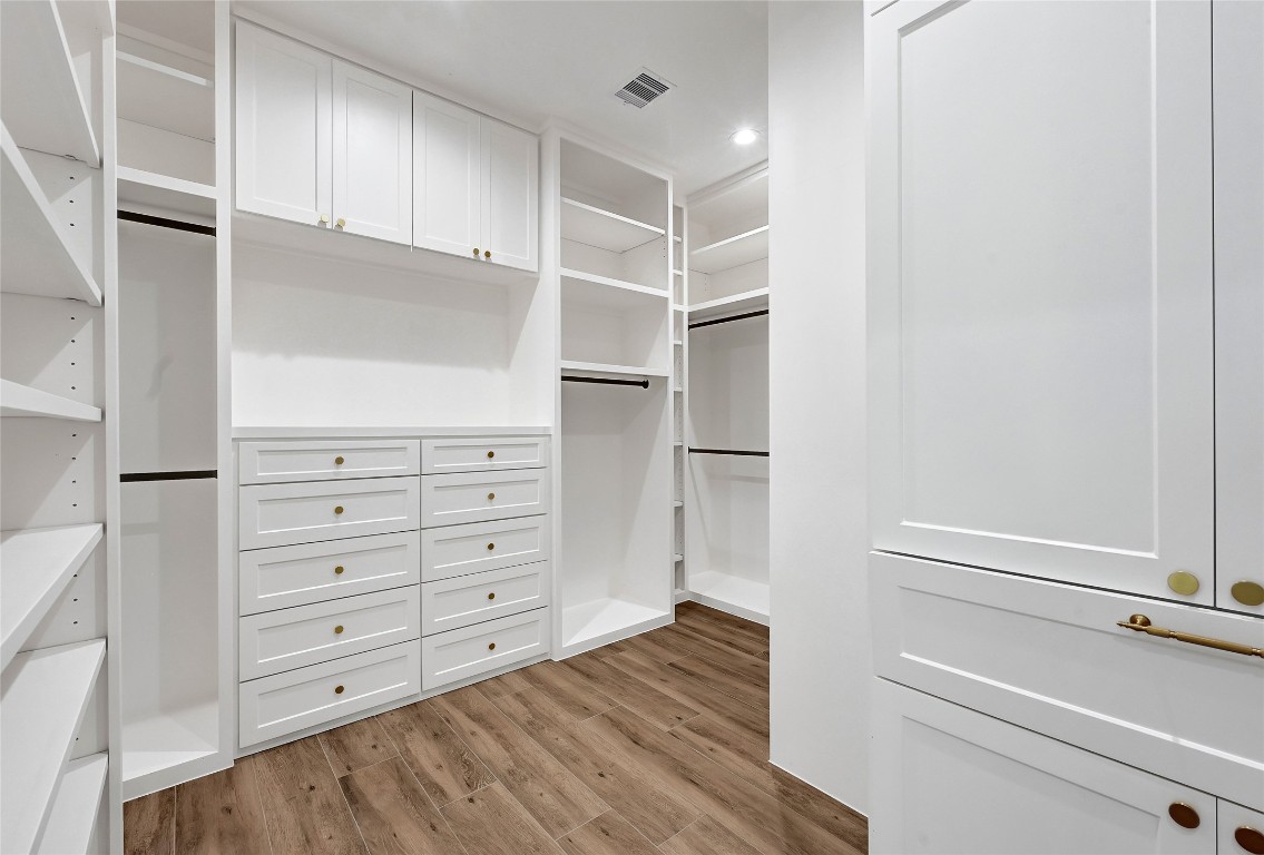 7244 Red Oak Grove Road Montgomery, TX 77316 - Photo 21 of 49 a view of walk in closet with empty racks