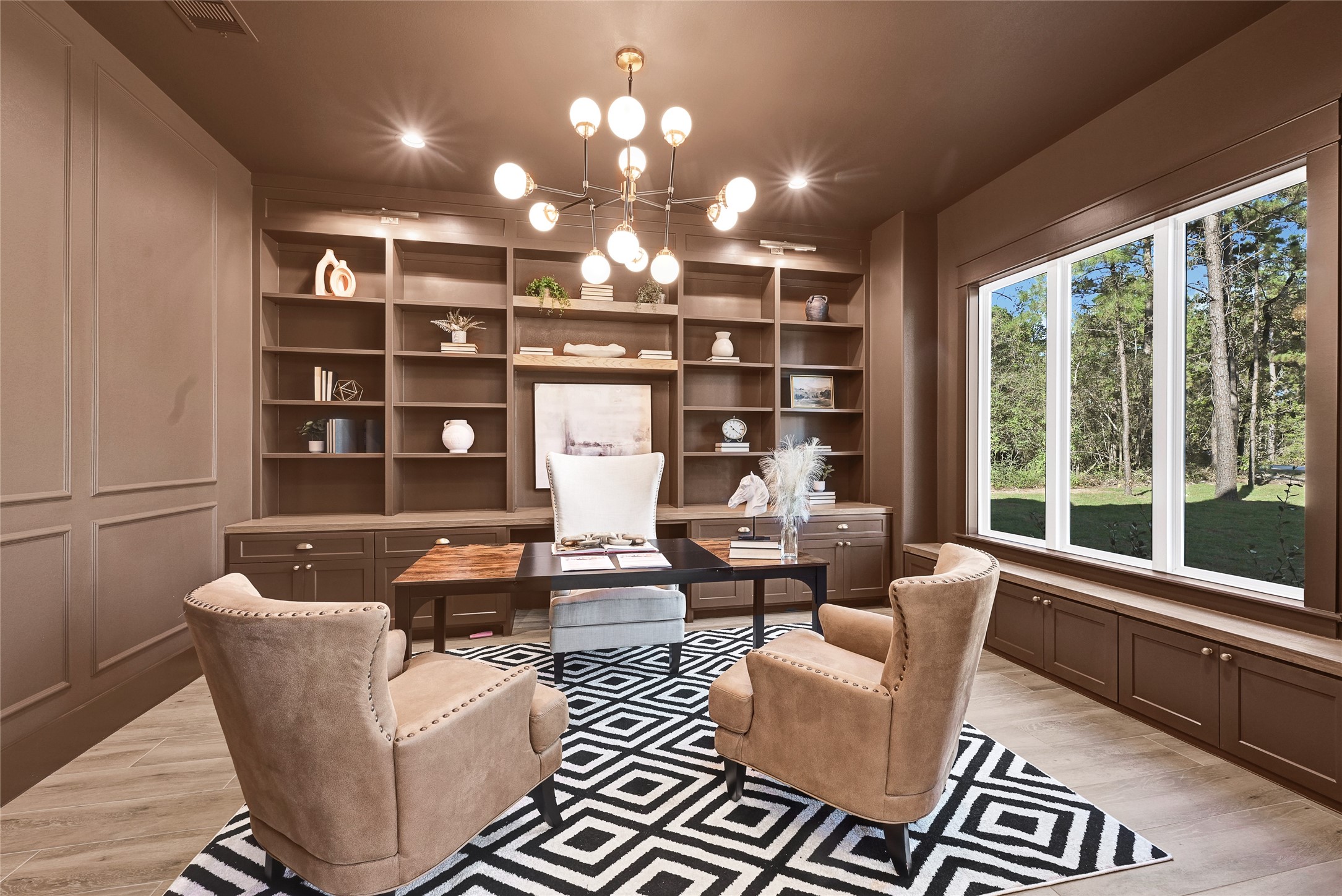 7244 Red Oak Grove Road Montgomery, TX 77316 - Photo 26 of 49 Home office featuring built-in cabinetry, custom lighting fixtures, and integrated window benches.