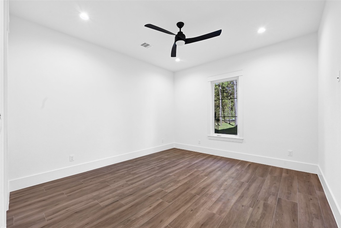 7244 Red Oak Grove Road Montgomery, TX 77316 - Photo 28 of 49 a view of empty room with wooden floor and fan
