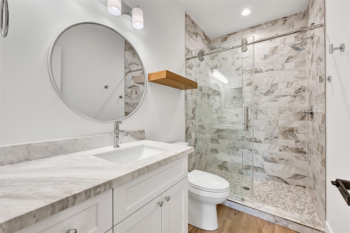 7244 Red Oak Grove Road Montgomery, TX 77316 - Photo 33 of 49 a bathroom with a sink a toilet and shower