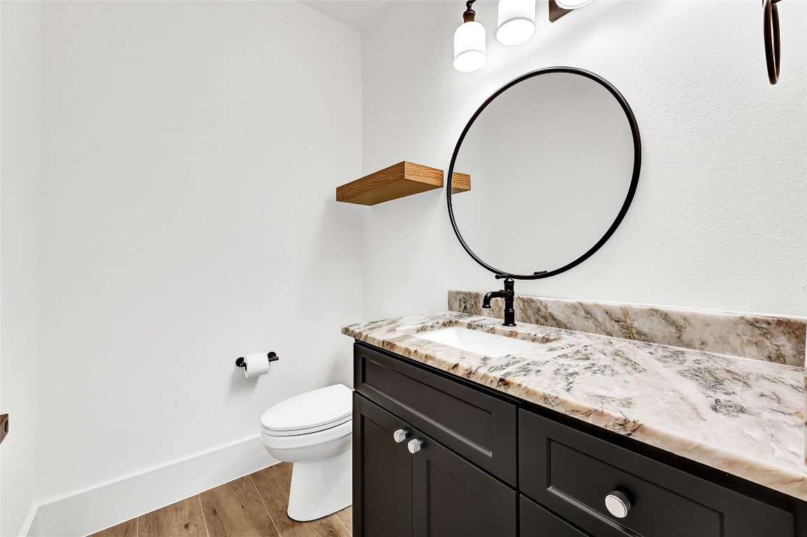 7244 Red Oak Grove Road Montgomery, TX 77316 - Photo 37 of 49 a bathroom with a granite countertop sink and a mirror