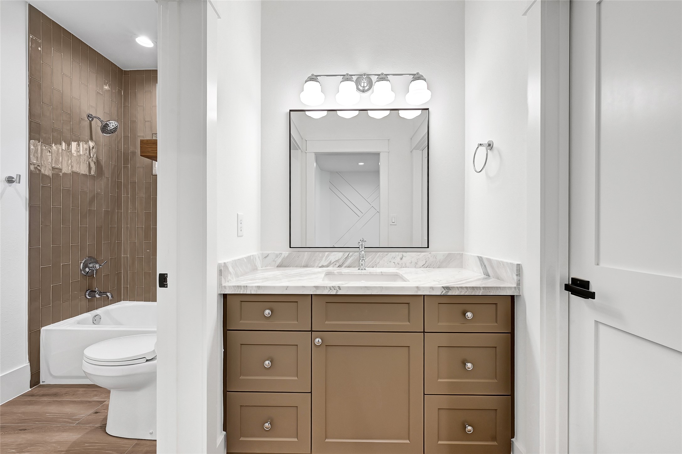 7244 Red Oak Grove Road Montgomery, TX 77316 - Photo 41 of 49 a bathroom with a granite countertop toilet a sink and a mirror