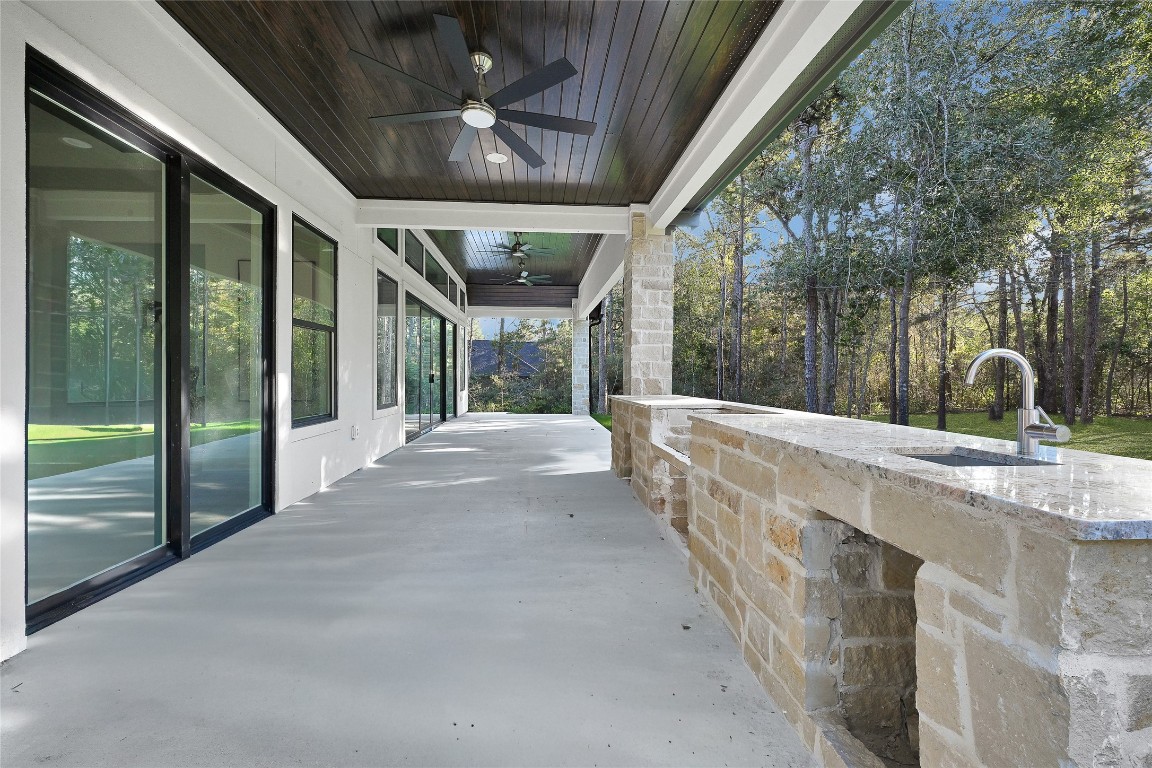 7244 Red Oak Grove Road Montgomery, TX 77316 - Photo 43 of 49 a view of porch with a flat tv screen and a large window