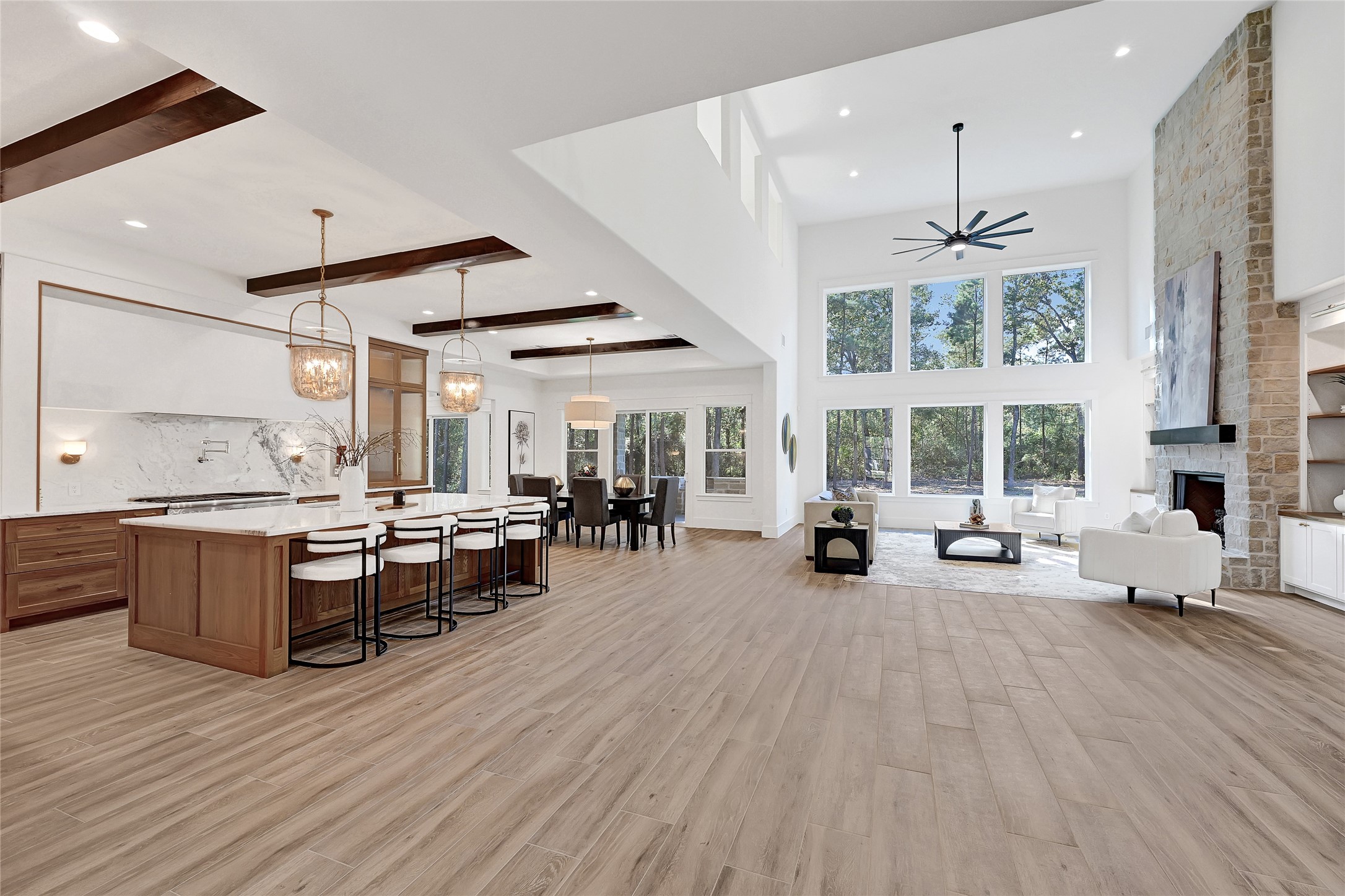 7244 Red Oak Grove Road Montgomery, TX 77316 - Photo 7 of 49 Gorgeous kitchen/living area. Features natural light, high-quality finishes, and functional elements for a warm, inviting atmosphere.