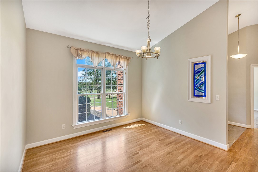 3620 Centerville Road Anderson, SC 29625 - Photo 31 of 49 Warm hardwood floors and a vaulted ceiling elevate this versatile dining space.