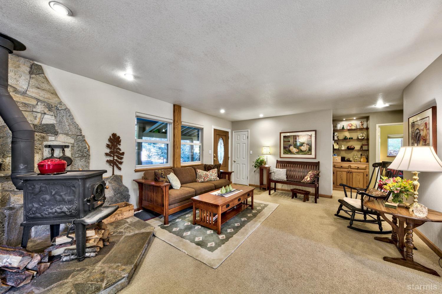 712 Sand Harbor Road South Lake Tahoe, CA 96150 - Photo 13 of 38 a living room with furniture and a flat screen tv with rug